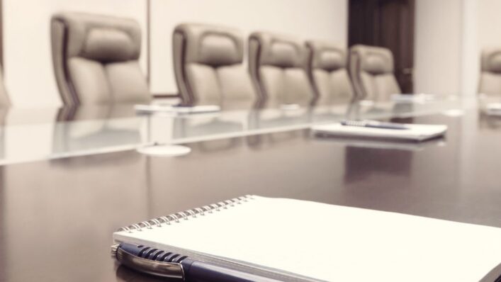 Modern boardroom prepared for a workplace grievance meeting.